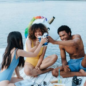 Three diverse friends enjoying a fun summer day by the lake.